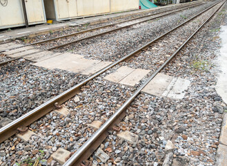The concrete block pathway for crossing the railway track between the platform.