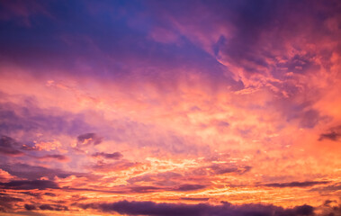 Lilac sky with orange in the late afternoon and low clouds