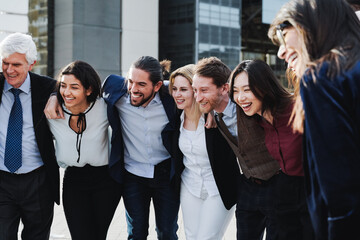 International group of business people having fun together outdoor with buildings on background - Entrepreneur lifestyle concept