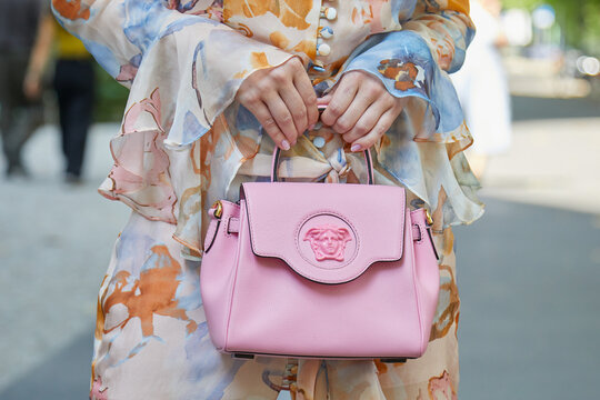 Woman with pink leather Versace bag on June 19, 2022 in Milan, Italy