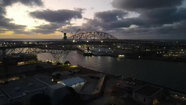 A Harbor bridge in Corpus Christi City at dusk and a cloudy sky