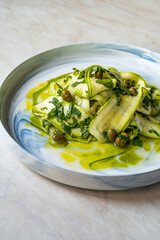 Salad Zucchini Slices with Pesto Sauce, Mint Leaves and Olive Oil.
