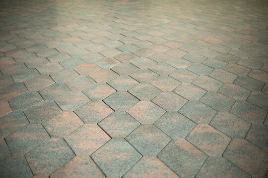 Tiles in city. Tratoir in details. Surface of road.