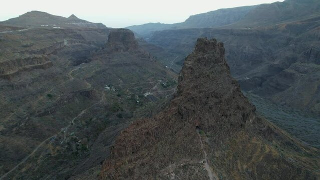 Ansite Fortress. Wonderful aerial shot in orbit of the Ansite Fortress on the island of Gran Canaria. Ancient Aboriginal caves are found inside. Monument recognized by Unesco.