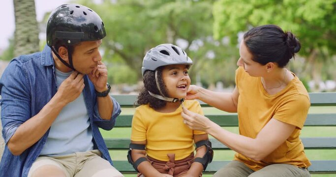 Mother and father teaching adopted daughter to roller skate. Family bonding while roller skating in the park. Putting safety helmet on for protection. Bonding together with her happy married parents