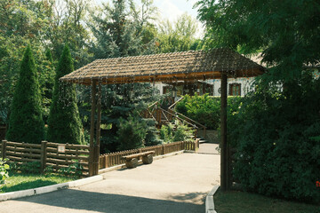 Traditional Ukrainian courtyard with a gazebo and a house in the national style