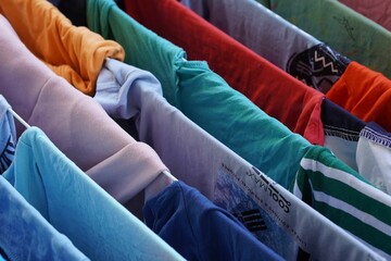 Colorful clothes on drying rack