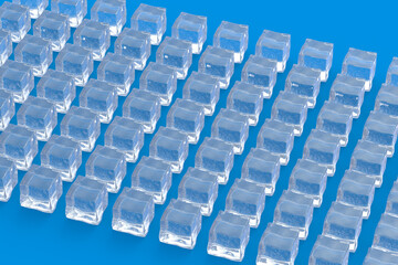 Fototapeta premium Many rows of ice cubes on blue background. 3d render