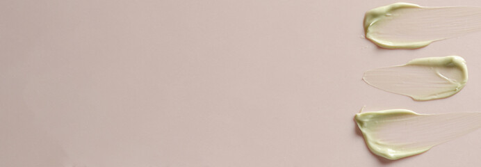 A sample of moisturizer on a pink background. Cosmetic product for the skin. Copy space