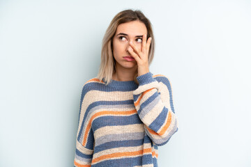 young adult pretty woman feeling bored, frustrated and sleepy after a tiresome, dull and tedious...