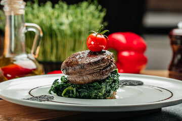 Medallions steaks from the beef tenderloin with spinach, Delicious balanced food concept