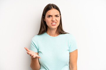 young adult pretty woman looking angry, annoyed and frustrated screaming wtf or what’s wrong with...