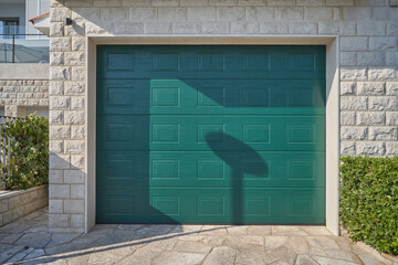 Modern green garage door. Automatic garage door