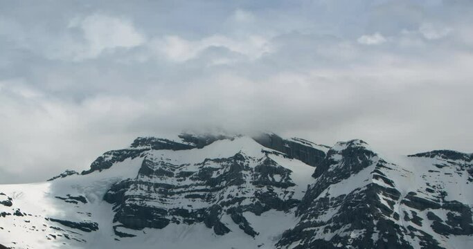 Timelapse of a mountain with clouds in the background in Champery, Switzerland