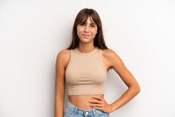 hispanic pretty woman smiling happily with a hand on hip and confident, positive, proud and...