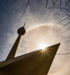 a low angel shot from Berlin Television Tower with sun and a rainbow © Thomas Richter/Wirestock Creators