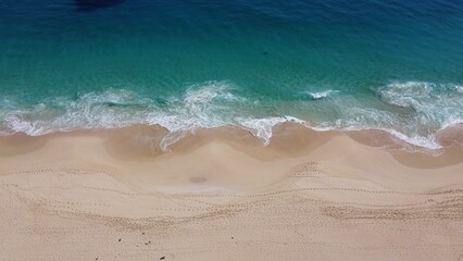 Aerial view of a scenic beach on a sunny day