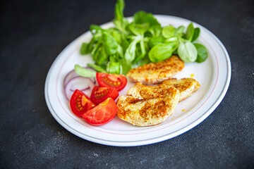 salad vegetables, fried chicken, green lettuce leaves cuisine fresh healthy meal food snack diet on the table copy space food background rustic top view keto or paleo diet