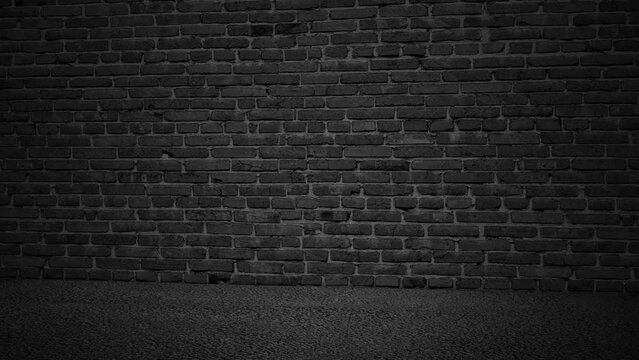 The studio is a moving black brick wall and an asphalt sidewalk.