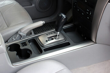 Obraz na płótnie Canvas Automatic gearbox lever, black interior car. Automatic transmission gearshift stick, Closeup a manual shift of modern car gear shifter