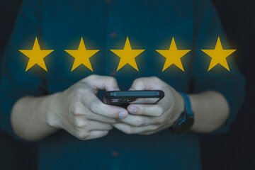 Customer review good rating concept, people use smartphone and show five star on visual screen for...