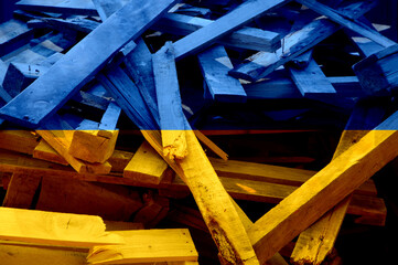 Ukrainian yellow and blue background,debris from bombing, war circumstances 