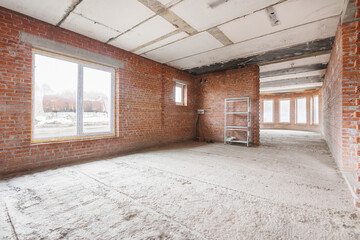 Fototapeta premium interior of the apartment without decoration in gray colors. rough finish