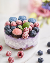 Vanilla ice cream cake with berries on the top. Selective focus. 