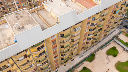 Aerial view of yellow buildings in Garbatella district, Rome, Italy. It is a residential area of ​​the city.