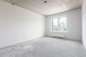 interior of the apartment without decoration in gray colors. rough finish