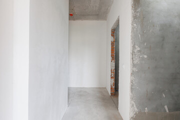 interior of the apartment without decoration in gray colors. rough finish
