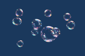 Flying soap bubbles isolated on blue background. Abstract background.