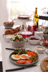 Many different dishes served on buffet table for brunch