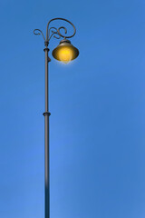 Beautiful old fashioned street lamp lighting outdoors