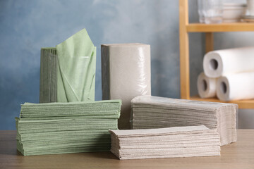 Many paper napkins on wooden table indoors