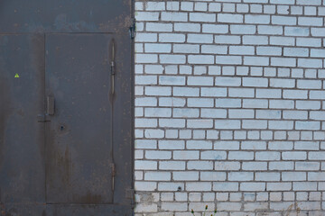 Pattern and texture background of old stone wall covered with clumps of green moss