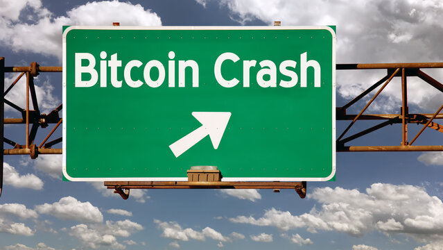 A view of a hypothetical "Bitcoin Crash" brown exit overhead road sign over a summer cloudscape. Bear market concept.	