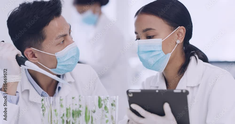 Poster Innovative biochemists making breakthrough and discovery in a medical facility while wearing face masks. Two scientist using a tablet and a pipette while working on covid research in a lab.
