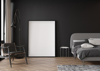 Empty vertical picture frame standing on parquet floor in modern bedroom. Mock up interior in contemporary style. Free, copy space for your picture, poster. Black wall, bed, armchair. 3D rendering.