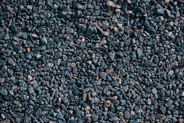 Gray small rocks ground texture black road stone background gravel pebbles clumping clay