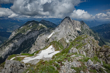 Fototapeta na wymiar Mountain hiking Trail Road. Between Italy and Austria: near Volaia Lake Raunchkofer Mountain (Lago di Volaia Monte Rauchkofel