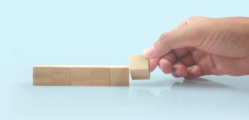 Wooden blocks in hand space and word decide