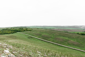 Naklejka premium mountains nature and green fields