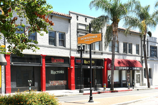 SANTA ANA, CALIFORNIA - 4 JUL 2022: Downtown Santa Ana sign in front of Hectors on Broadway.