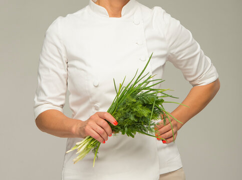person cook holding bunch of fresh herbs.diet kitchen vegan concept