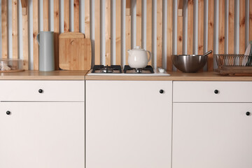 Modern new light interior of kitchen with white furniture.