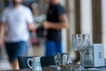 Empty Glasses in the Street on the Table after Touristic Breackfast in the morning in Italy
