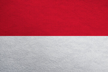 Modern shine leather background in colors of national flag. Monaco