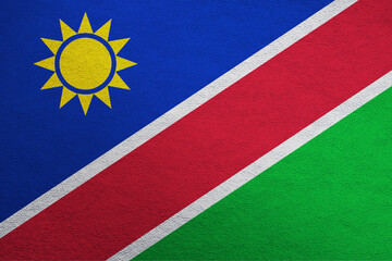 Modern shine leather background in colors of national flag. Namibia