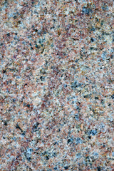 Multicolored granite stone surface with crystals